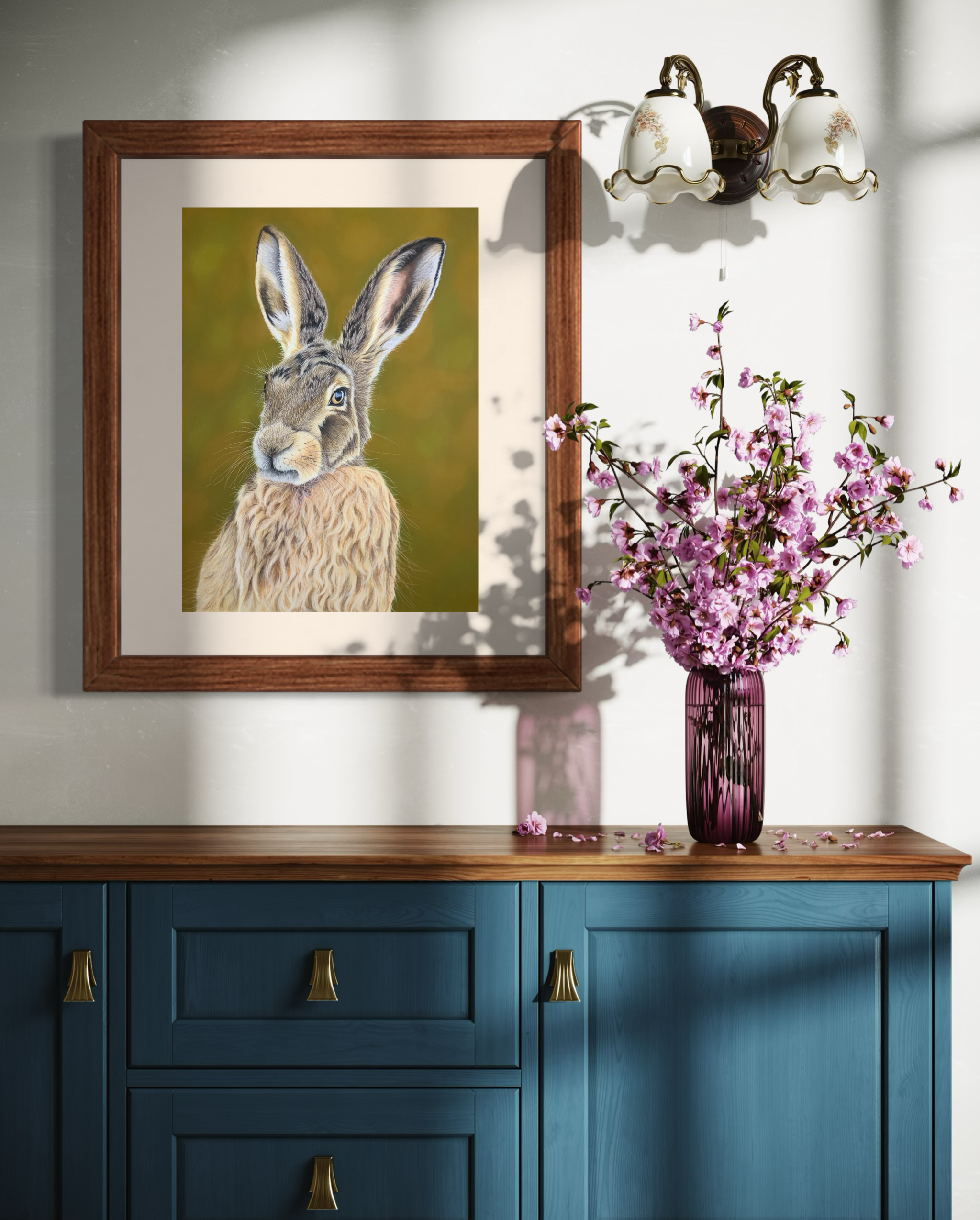 Framed art print of a hare against a green woodland inspired background