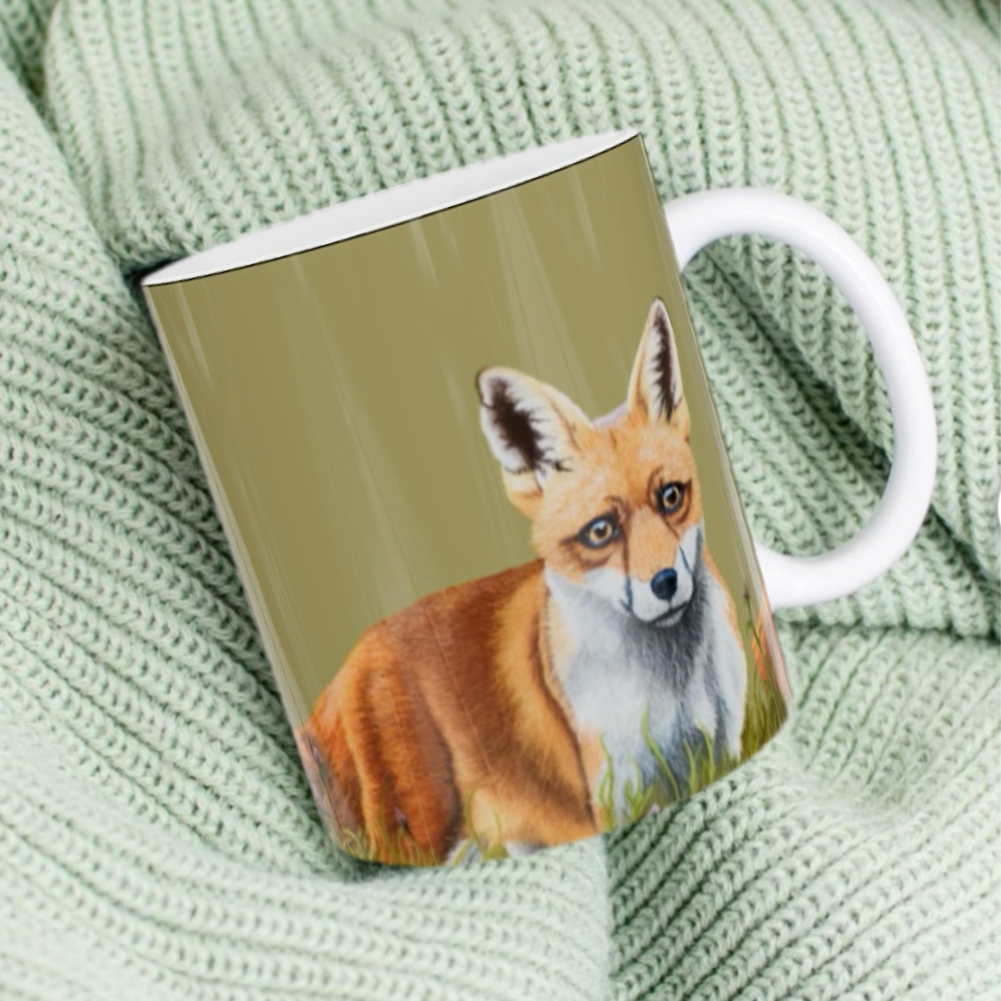 11oz ceramic mug with fox illustration against sage green background