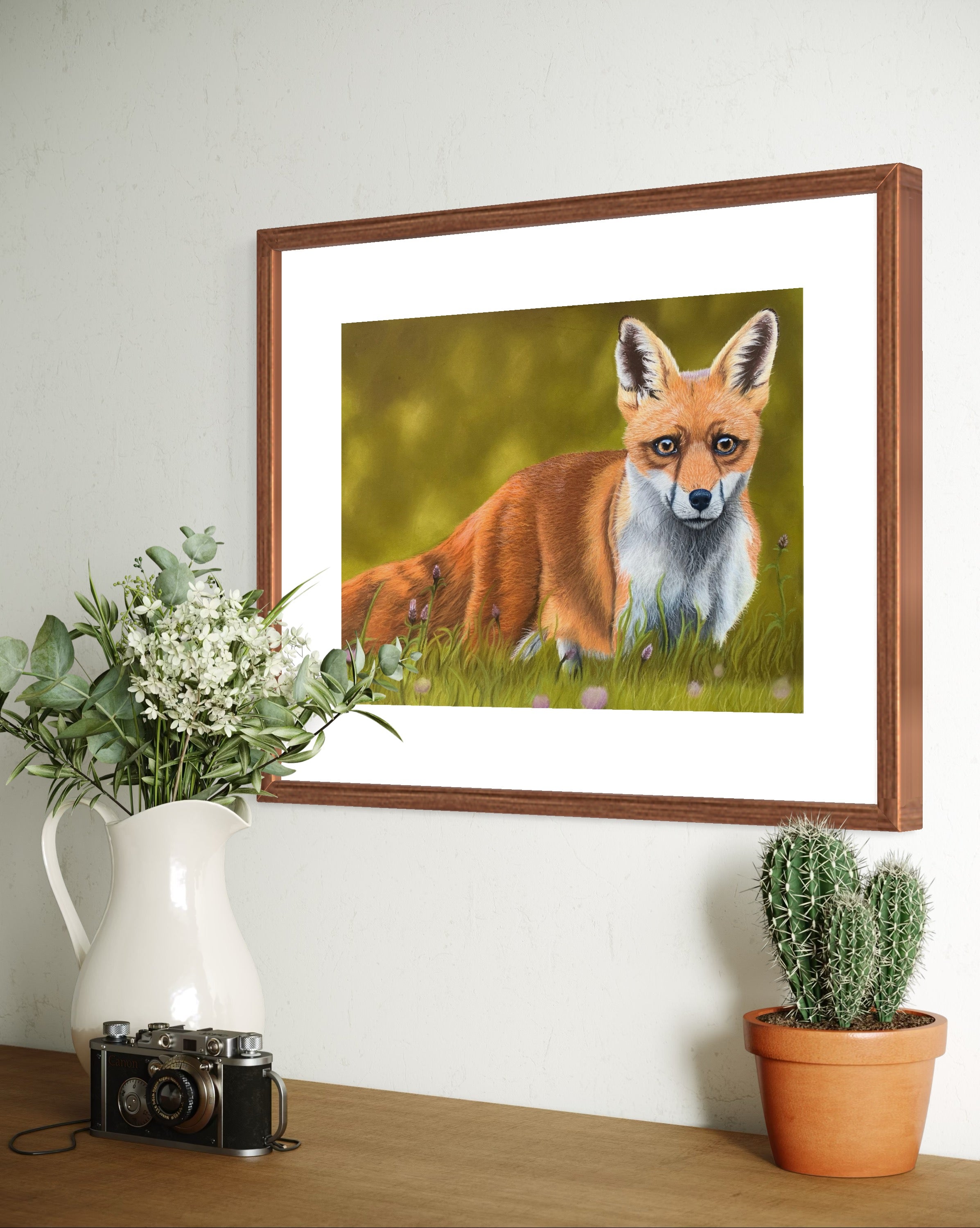 Framed art print of a fox against a green woodland inspired background
