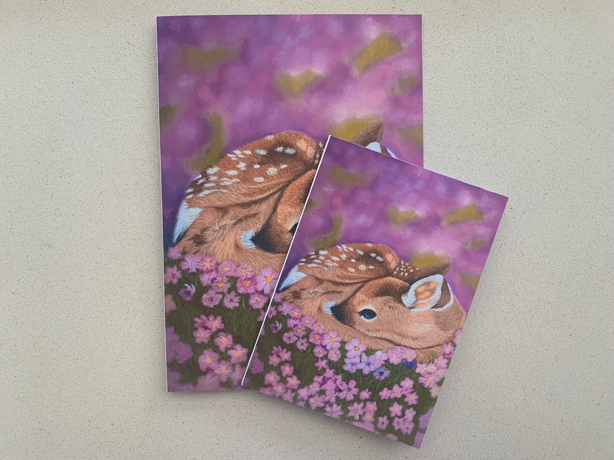Two cards with sleeping baby deer laying in purple wildflowers